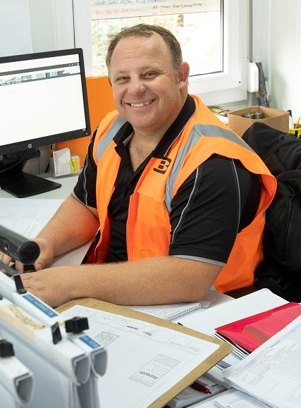 Construction site manager sitting at his desl