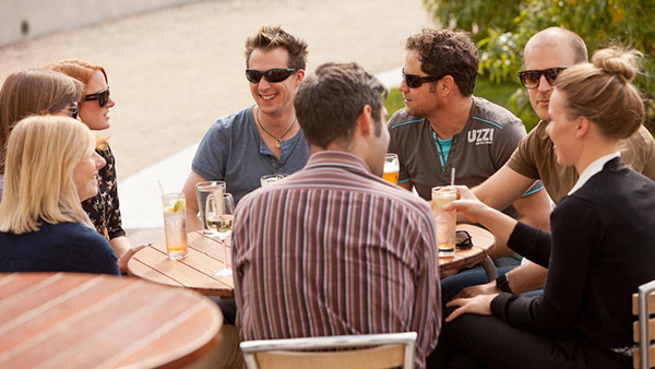 Family discussing how New Zealanders talk and meet friends