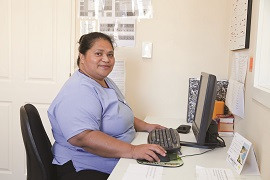 Nurse sitting at a computer desk