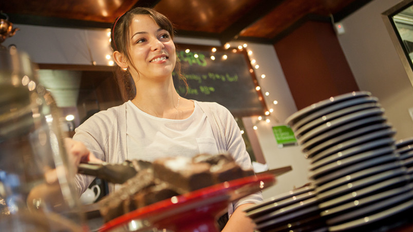 Cafe worker serving food