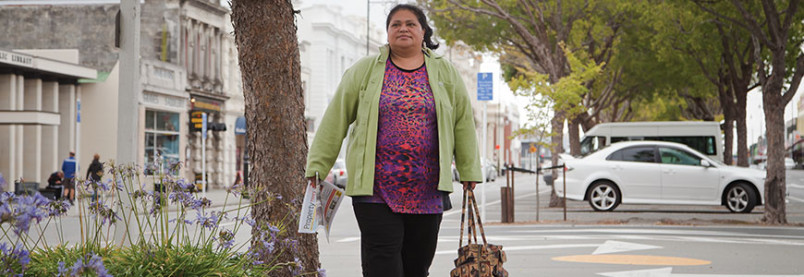 A woman walking down a street