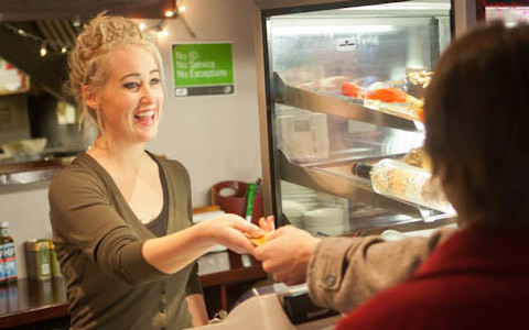 Customer paying in a cafe