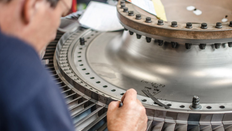 Man working in factory on machine